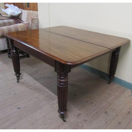 587 - A Victorian mahogany extending dining table, the table top with moulded edge having deep frieze and ... 