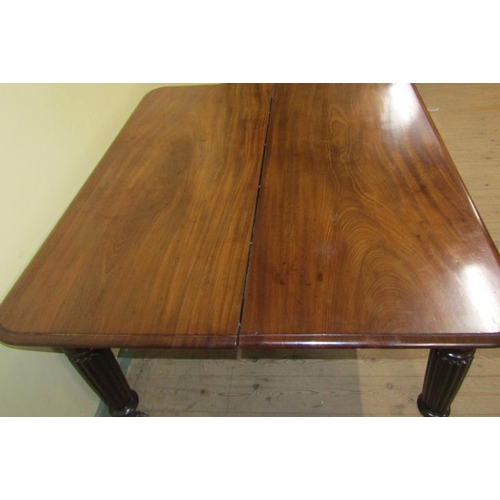 587 - A Victorian mahogany extending dining table, the table top with moulded edge having deep frieze and ... 