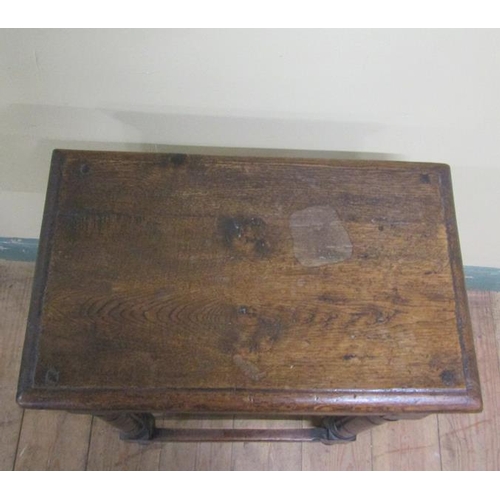 609 - An oak joint stool, the top of rectangular form with moulded edge on plain frieze with ring turned l... 