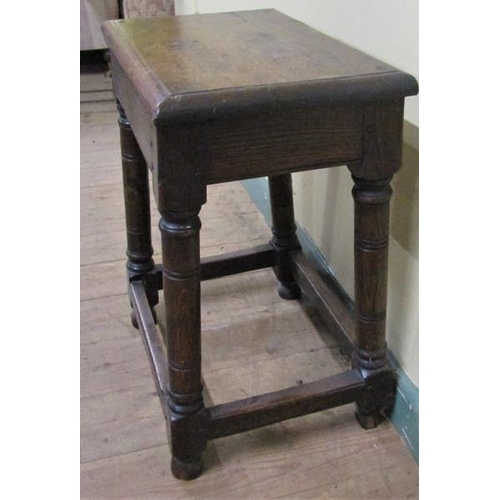 609 - An oak joint stool, the top of rectangular form with moulded edge on plain frieze with ring turned l... 