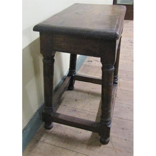 609 - An oak joint stool, the top of rectangular form with moulded edge on plain frieze with ring turned l... 