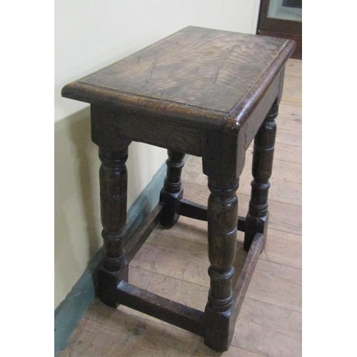 611 - An oak joint stool of rectangular form with moulded edge with baluster ring turned legs on block car... 