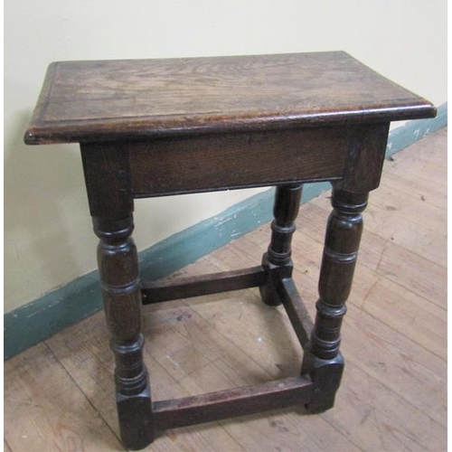 611 - An oak joint stool of rectangular form with moulded edge with baluster ring turned legs on block car... 