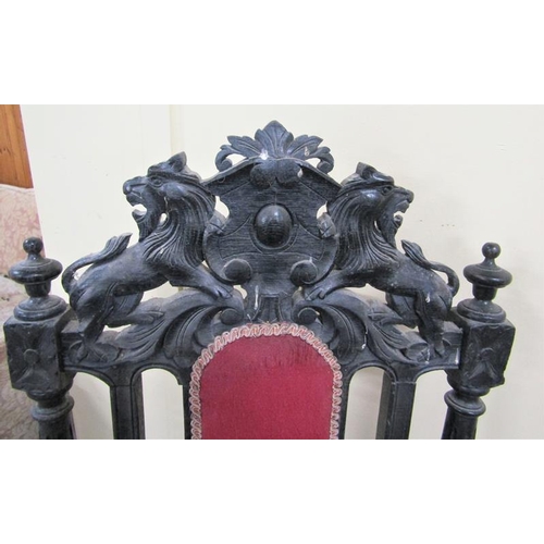 617 - A late Victorian set of eight (6 +2) oak dining chairs, ebonised, all with lion and shield pediments... 