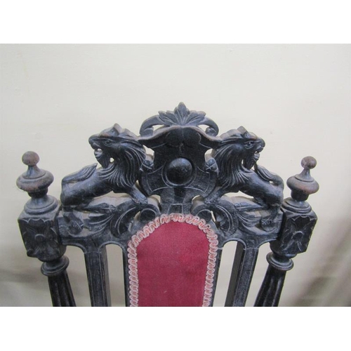 617 - A late Victorian set of eight (6 +2) oak dining chairs, ebonised, all with lion and shield pediments... 