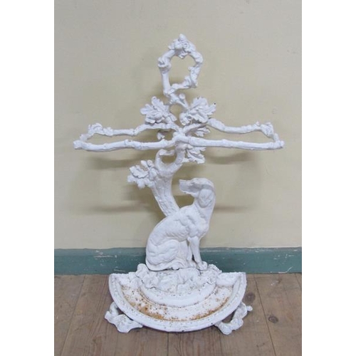 33 - A Victorian cast iron stick stand cast as a seated dog under a tree, white painted.  72cms h.