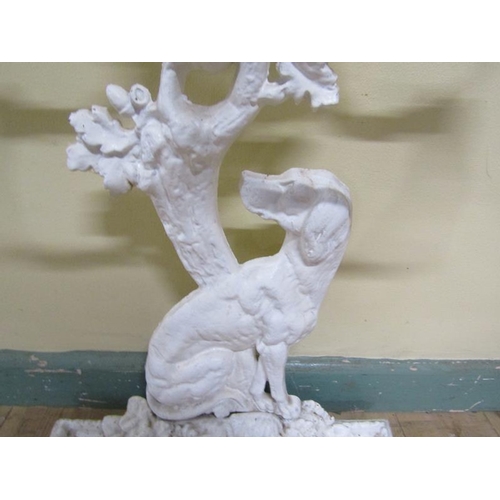 33 - A Victorian cast iron stick stand cast as a seated dog under a tree, white painted.  72cms h.