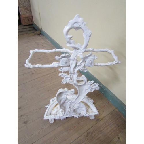 33 - A Victorian cast iron stick stand cast as a seated dog under a tree, white painted.  72cms h.