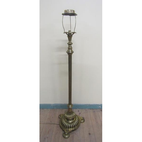 35 - A late Victorian brass oil lamp stand with electrical fittings with adjustable reeded column on a ci... 