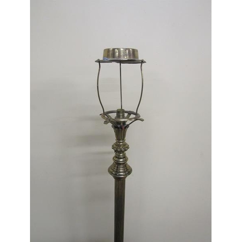 35 - A late Victorian brass oil lamp stand with electrical fittings with adjustable reeded column on a ci... 