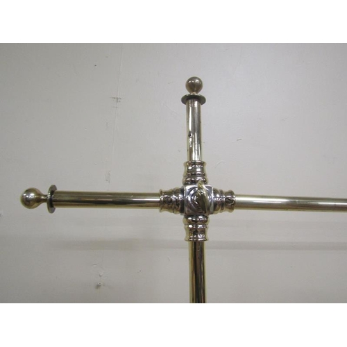 36 - A 19c brass and steel clothes rail of adjustable height.  132cms w x 193h.