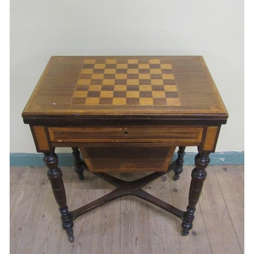 541 - A late Victorian mahogany swivel top games/needlework table with chequerboard top, fitted one long d... 