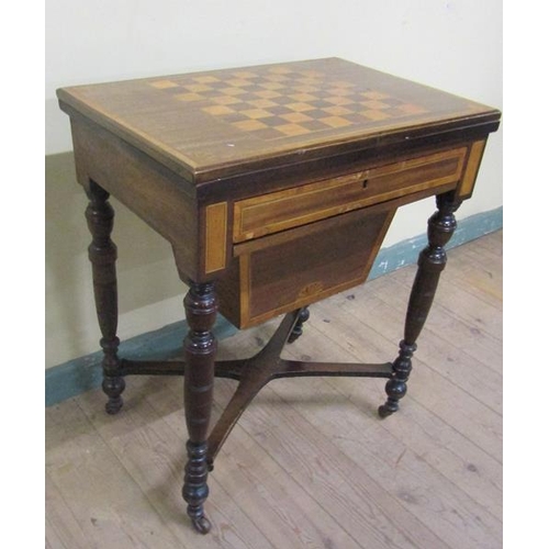 541 - A late Victorian mahogany swivel top games/needlework table with chequerboard top, fitted one long d... 