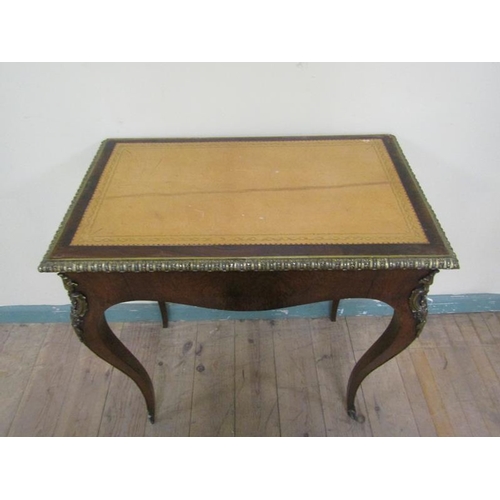 542 - A 19c French rosewood writing table or rectangular form, the top with tooled leather insert within a... 