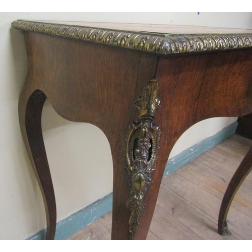 542 - A 19c French rosewood writing table or rectangular form, the top with tooled leather insert within a... 