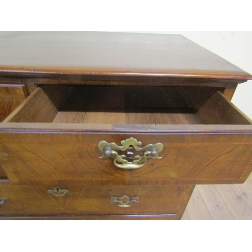 568 - Late Georgian figured walnut veneered chest of two short and three long drawers, all with brass fitt... 