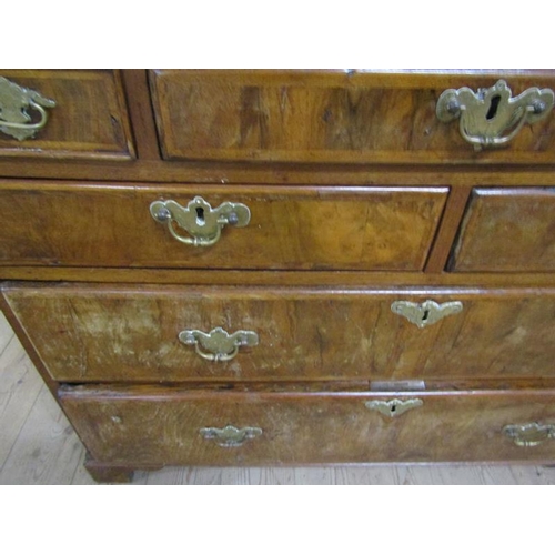 569 - A mid Georgian figured walnut veneered cross banded bureau with fall front and fitted interior over ... 