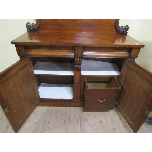 579 - A mid Victorian panel back chiffonier, the panel back with applied scroll mouldings and fitted two f... 