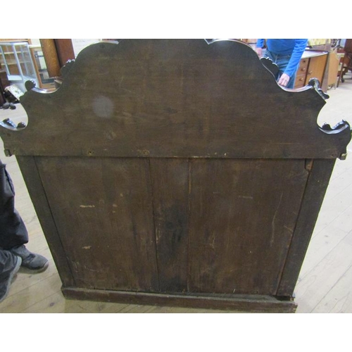 579 - A mid Victorian panel back chiffonier, the panel back with applied scroll mouldings and fitted two f... 