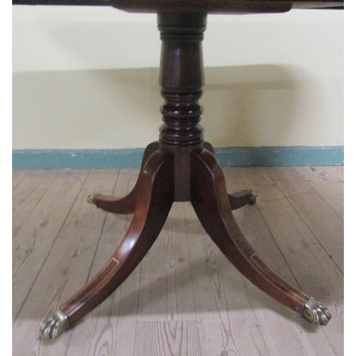 582 - A Regency figured mahogany rosewood and brass rail cross banded breakfast table, tilt top on a pedes... 