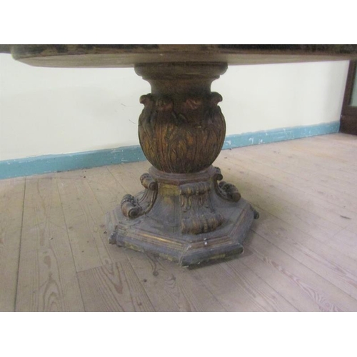 583 - A late 19/early 20c marble top low table on bold baluster carved gilt wood base.  100cms w x 58cms h... 