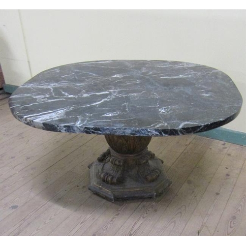 583 - A late 19/early 20c marble top low table on bold baluster carved gilt wood base.  100cms w x 58cms h... 