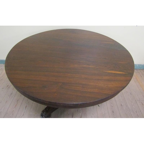 584 - A William IV rosewood circular tilt top breakfast table on a facet column with tripartite base and c... 