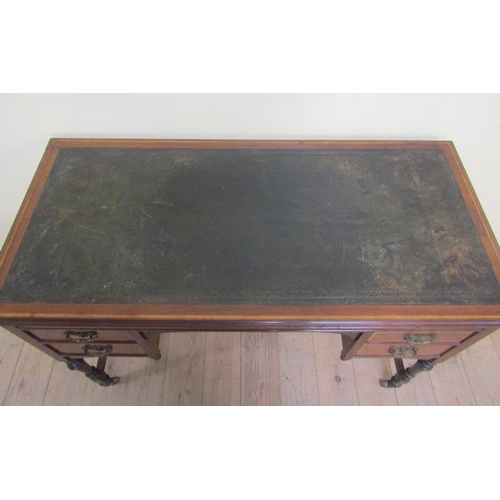 585 - A late 19c/early 20c mahogany marquetry decorated writing table with tooled green leather insert and... 