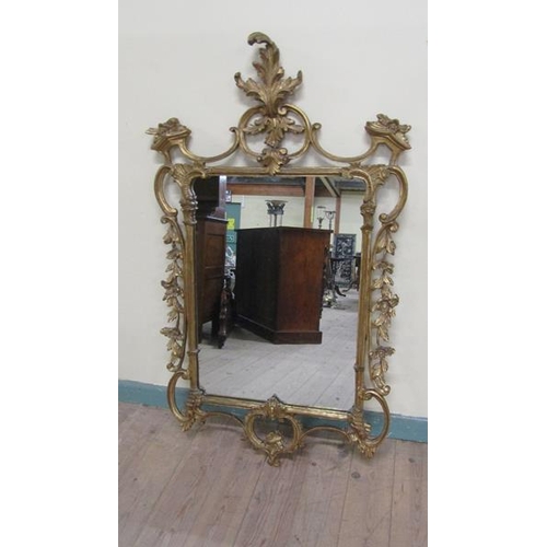 591 - A mid Georgian style gilt wooden stucco wall mirror with scrolling leaf pediment sides and base.  73... 