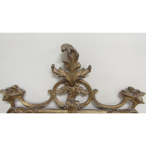 591 - A mid Georgian style gilt wooden stucco wall mirror with scrolling leaf pediment sides and base.  73... 