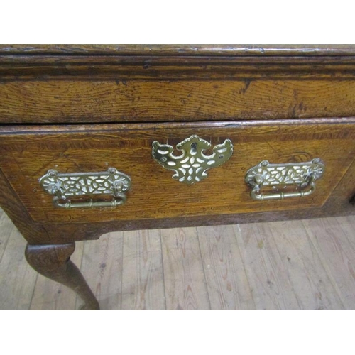 601 - A late 18c Midlands oak three drawer dresser base, the drawers with pierced brass back plates and es... 