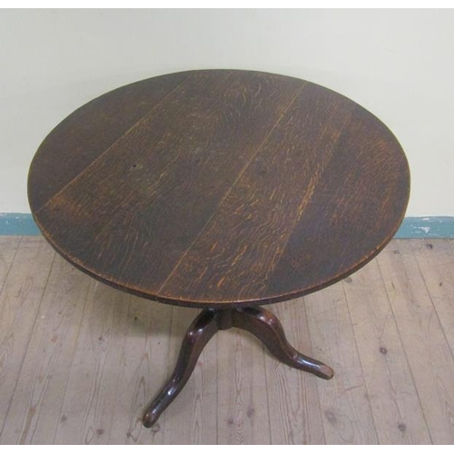 605 - A George III oak circular pedestal tripod table 73cms dia x 64cms h.