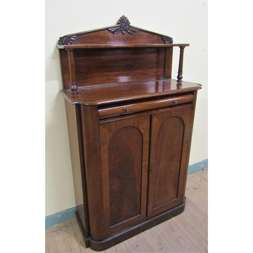 612 - A Victorian mahogany chiffonier with moulded back board and upper shelf on turned supports having on... 