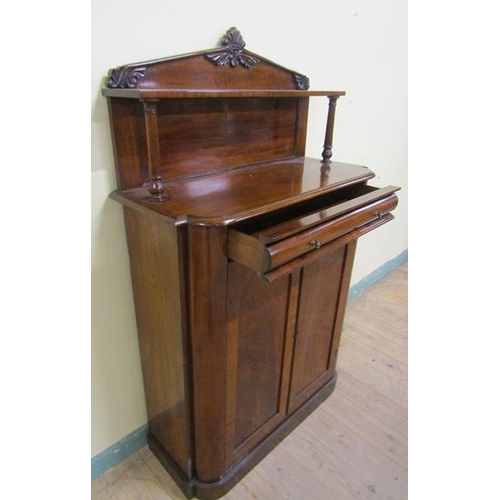 612 - A Victorian mahogany chiffonier with moulded back board and upper shelf on turned supports having on... 