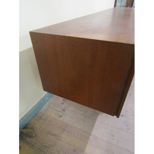 619 - An Ideal Heim teak sideboard of substantial form fitted with six pull-out shelves and one deep drawe... 