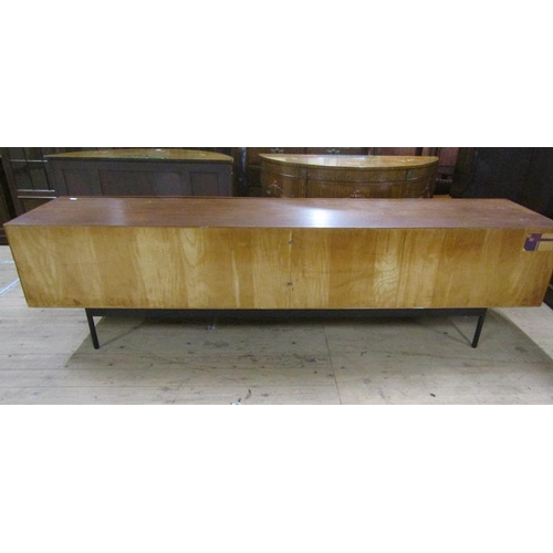 619 - An Ideal Heim teak sideboard of substantial form fitted with six pull-out shelves and one deep drawe... 