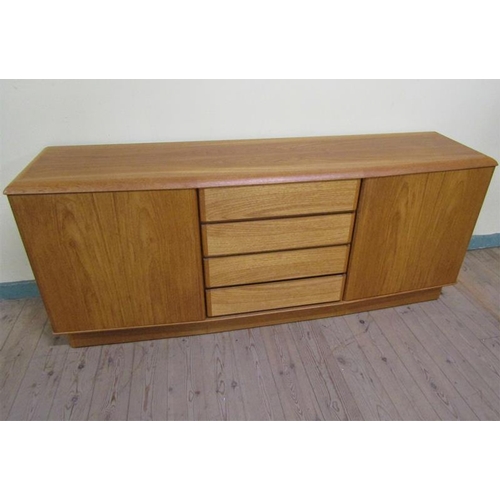 621 - A Nordic furniture teak sideboard fitted four central drawers by two shelved cupboards enclosed by s... 