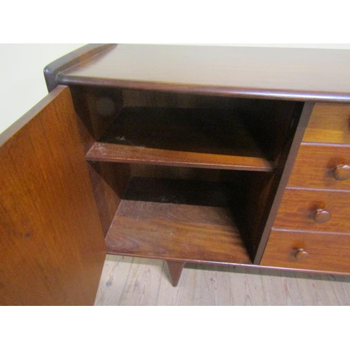 624 - A 1970s Younger Limited teak sideboard fitted four graduated central drawers flanked by two shelved ... 