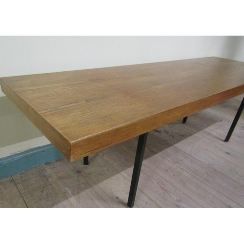 630 - A 1970's teak low table by Ideal Heim of rectangular form supported on black painted straight steel ... 