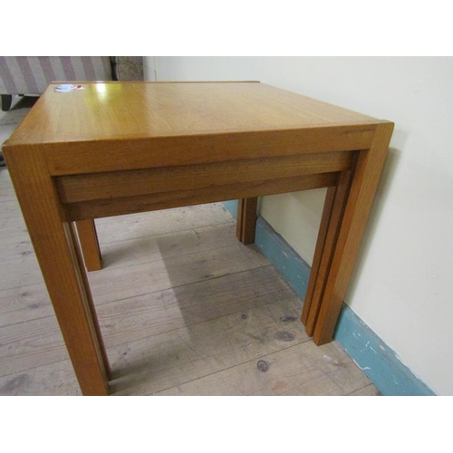 635 - A nest of three 1970's teak occasional tables, the largest 53cms w x 53cms h.