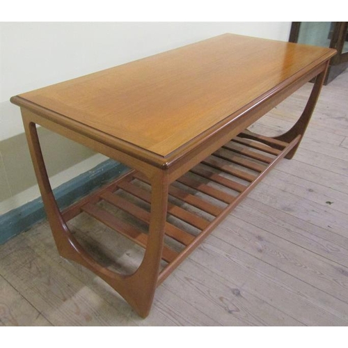 637 - A G Plan teak low table of rectangular form with moulded edge having a slatted under tier shelf.  11... 