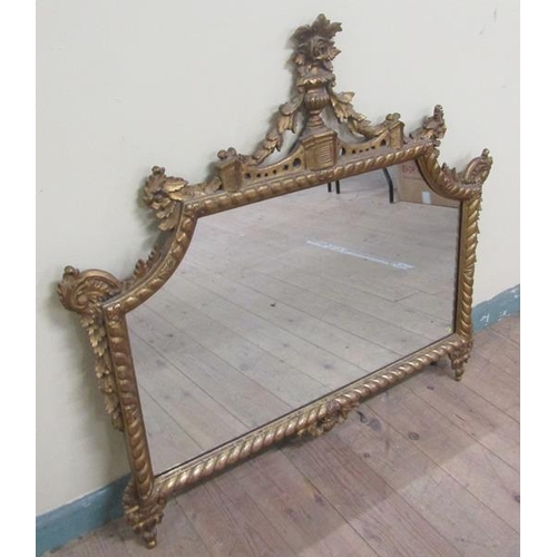 598 - A mid Georgian style gilt wooden stucco wall mirror within a serpentine gilded frame having an open ... 