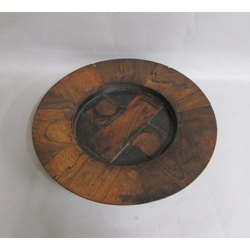 75 - A 19c rosewood alms dish of circular dish form with cruciform centre.  40cms dia.