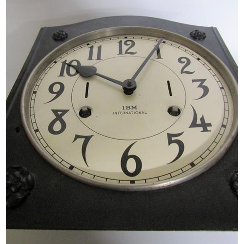 14 - An early 20c movement from an industrial time clock complete with its mounting bracket now mounted o... 