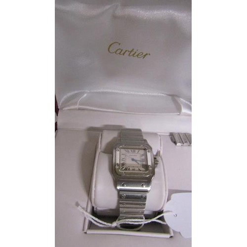 136 - A Cartier Santos midi steel gents wristwatch, serial no. 963566CD sold in 2014 and having a rectangu... 