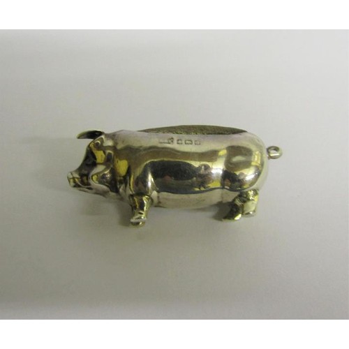 223 - An Edwardian silver pig pin cushion, makers mark for Levi & Salaman, Birmingham 1903.  5cms l.