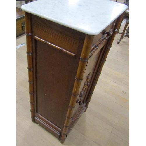 642 - A Victorian pine simulated bamboo marble top pot cupboard, 39cms w, 87cms h.