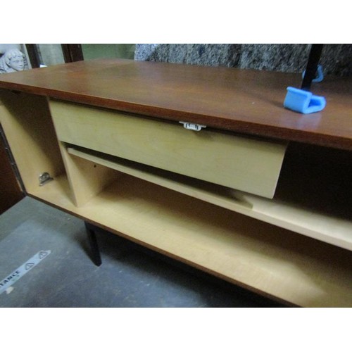 619 - An Ideal Heim teak sideboard of substantial form fitted with six pull-out shelves and one deep drawe... 