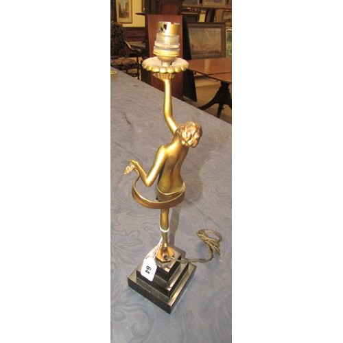 64 - An art deco gilt metal dancing figure table lamp supported on stepped marble base, electrolier.  The... 