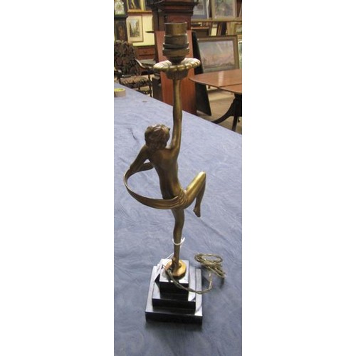 64 - An art deco gilt metal dancing figure table lamp supported on stepped marble base, electrolier.  The... 